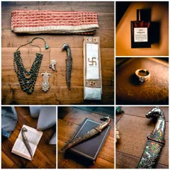 A flat lay of the groom's traditional accessories, including his ceremonial dagger (kirpan), emerald necklace, and wedding ring, showcasing the rich heritage.
