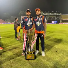 This is what dedication looks like. We are incredibly proud of our student Karan Sharma, captain of Kashi Rudras, holding the UP T20 trophy. His success is a testament to the hard work we value.