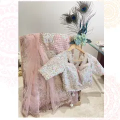 A stunning pink lehenga deserves a grand display. We created this luxury trousseau packing setup using a wooden stand and peacock feathers to complement the intricate embroidery of the outfit.