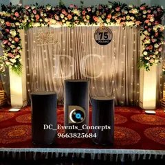 A sophisticated stage for a 75th birthday celebration. The elegant floral arrangements, shimmering backdrop, and custom signage create a distinguished look befitting such a major milestone.