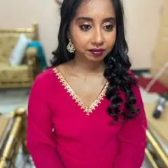 A lovely non-bridal makeover for a client attending a party. The focus is on a fresh, youthful glow with soft curls and a complementary lip color.