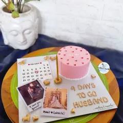 My bestseller for a reason. This anniversary platter features a Hazelnutella bento cake surrounded by personal touches like a custom calendar and your favorite photos, making it a super heartfelt gift.