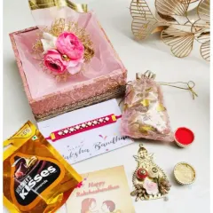Celebrate the bond of love with my exclusive Rakshabandhan hamper. This one includes a beautiful rakhi, Hershey's Kisses, and traditional roli chawal in a decorative box.