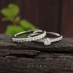 Two lives, one journey. This elegant wedding ring set, featuring a diamond solitaire and a matching pavé band, is crafted to symbolize your union. I designed these to sit perfectly together, reflecting a seamless and beautiful partnership.