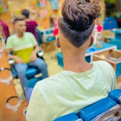 The back view shows the precision of the V-cut neckline. This detail adds a sharp, custom finish to the overall fade haircut.
