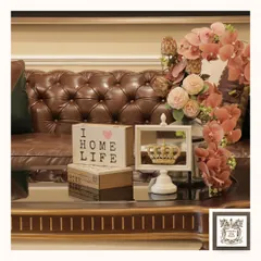 The "Crowning Glory" mirror shown in white, offering a lighter but equally regal feel. It pairs beautifully with other decorative objects to create a charming tabletop display.