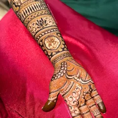 The full arm design for the dancer bride, with intricate patterns and the ghungroo motif taking center stage. A truly unique and custom bridal design.