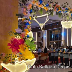 A beautiful floral and butterfly archway inside the party venue, creating a whimsical atmosphere for guests.