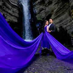 Our royal blue trail gown makes a splash in any nature setting. The rich color stands out beautifully against the natural tones of this waterfall location, and the flowing train adds a touch of magic and romance to your pre-wedding photos.