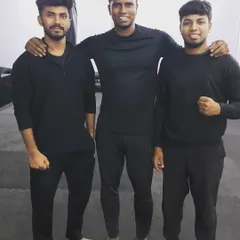 A candid moment with my fellow fitness coaches at the gym. We all happened to show up in black, a "men in black" moment.
