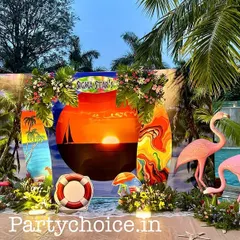For this corporate poolside party, we created a complete beach-themed environment. The setup features a custom sunset backdrop, surfboard props, flamingo figures, and tropical foliage to create an immersive and fun atmosphere for guests.
