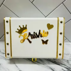 This elegant white and gold leatherette trunk box can be personalized with any name, making it a perfect storage box for jewelry, letters, or other special items.