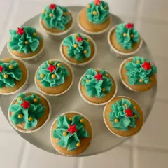 Getting into the festive spirit with our Christmas-themed mini cupcakes. The green frosting and star toppers make them a perfect addition to any holiday party.