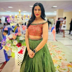 A heartwarming transformation. We took our client's mother's traditional saree and repurposed it into this stylish off-shoulder crop top and pleated lehenga skirt. It’s a beautiful way to honor family heritage while creating a new, modern look.