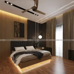 Luxury is in the details. This bedroom features a dramatic feature wall with wooden and rafter panels, a plush cushion headboard, and a bed with under-glow lighting. The false ceiling combines gypsum with profile lights for a modern, layered look.