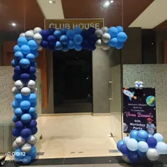 Welcome aboard! An outer space-themed entrance for Vivan's 6th birthday, featuring a blue and silver balloon arch leading into the 'Club House' and a rocket-themed welcome sign.