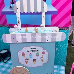 The adorable pastel-colored wooden ice cream cart, stocked with play ice cream cones and popsicles for sweet, imaginative fun.