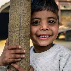 This is one of my favorite shots. The pure, unguarded joy in this boy's smile is what I'm always searching for in my street photography. It's these simple, happy moments that make the best pictures.