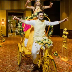 A quirky and fun Haldi entry on a decorated cycle rickshaw. We love creating unique entry concepts that reflect the couple's personality and the event's theme.