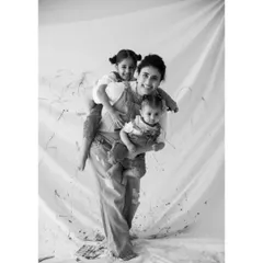 The beautiful chaos of motherhood, captured during a playful 'Paint Me' session. I love freezing these moments of pure joy, where laughter is the only thing that matters.