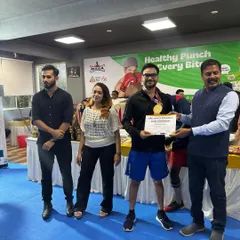 A proud moment as our boxer receives his gold medal and certificate at the championship ceremony. This is the glory that follows the sweat and blood.
