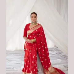 A beautiful portrait of Sonakshi in her stunning red reception saree. We aim to capture not just the outfit, but the personality and grace of the person wearing it.