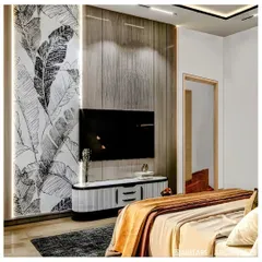 In this cozy bedroom, I used a combination of wood-paneled and wallpapered accent walls to create a warm, layered look. The black and white botanical print adds a graphic element, balanced by the warm tones of the bedding.