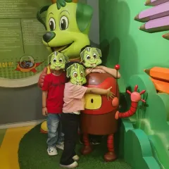 Kids in Tinga masks have fun posing with our friendly mascots, Tinga Dojo and Boxy.