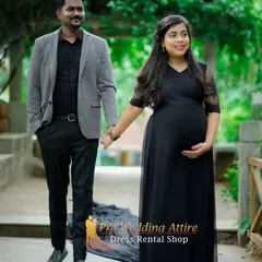 A classic black flowy gown is a must-have for a timeless couple's maternity shoot. The dress drapes beautifully, and its simplicity allows the happy connection between the parents-to-be to shine.