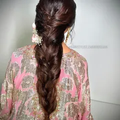 A classic, thick braid with a twisted crown, perfect for a traditional event. This style is elegant and timeless, and can be adorned with flowers or accessories.