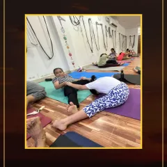 Stretch, Strengthen, Shine. Here, a student is in a deep leg stretch, which is excellent for improving flexibility, balance, and circulation.