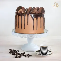 Gautam from Sarojini Nagar is diving into a chocolate dream with this cake. It's loaded with chocolate bars and has a rich, glossy drip, making it the ultimate treat for a chocolate lover's birthday.