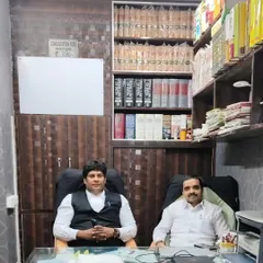 In my office chamber with a senior colleague. Our combined experience helps us strategize and build strong arguments for every client we represent.
