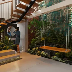An indoor courtyard featuring a wooden swing suspended over a green space with a small waterfall. The design includes a floating staircase and a textured accent wall.