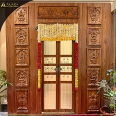 An example of my dedication to traditional craftsmanship, this magnificent wooden puja room door is adorned with intricate carvings of deities. The design is complemented by festive marigold garlands, creating a truly sacred and welcoming entrance.