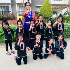 This picture fills my heart with so much joy! Here I am with my wonderful little students, all dressed up as little Shivas for a Shivratri performance. Seeing their happy faces is why I love teaching kids' dance classes.