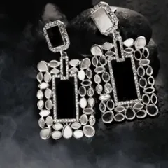 Moody and dramatic, this shot features statement earrings against a dark, smoky background, highlighting their intricate design and giving them a luxurious feel.