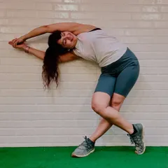 Movement meets mindfulness. This image captures the feeling of a deep side-body stretch after a workout. It's in these moments of stillness and release that we connect with our bodies and integrate the strength we've built.