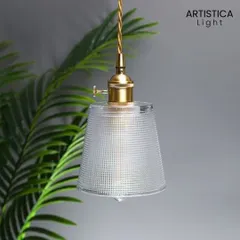 This simple yet beautiful pendant features a textured glass shade and vintage-style brass fitting. The warm glow it produces is like a hug for your soul, making it the perfect hanging light for a cozy reading nook or beside your bed.