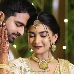 For this couple's ring exchange ceremony, I created a timeless and romantic look. The focus was on luminous skin, a classic red lip, and beautifully defined eyes that complemented her intricate henna and stunning white and gold lehenga.