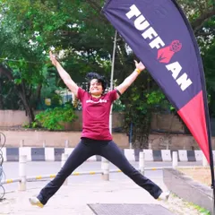 An energetic jump for joy at the Tuffman launch event. This is the kind of energy I bring to my coaching and my life!
