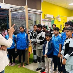 My role as a coach goes beyond technique; it's about building confidence and a winning mindset. Here, I am briefing our young shooters before a training session at our Hulimavu academy.