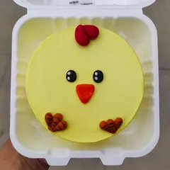 A sweet little chick bento cake. This simple and adorable design is perfect for celebrating spring, Easter, or a new baby.