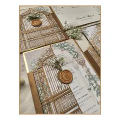 A closer look at the details of our laser-cut invitation, showing the delicate gate design and the custom wax seal with dried baby's breath. It's these small, thoughtful touches that make an invitation truly memorable.