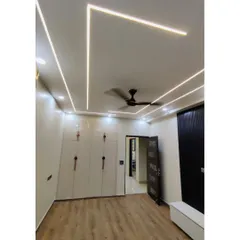 A sleek, modern wardrobe with high-gloss white doors and minimalist handles. The design is clean and contemporary, providing a large amount of storage without overwhelming the space.