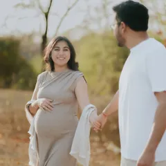A beautiful shot of an expecting mother being led by her partner. This image symbolizes their journey into parenthood together, captured in soft, natural light.