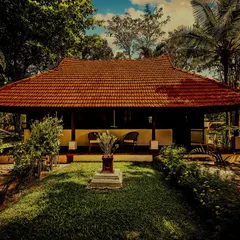 An 18th-century heritage wooden cottage, now a tranquil retreat for our guests. Surrounded by lush gardens, this accommodation offers an authentic experience, blending historical charm with the holistic practices of Ayurveda and yoga.