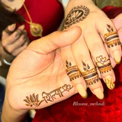 A sweet and simple design for a couple. Her hand features his name, while his hand features hers, both written in a lovely script and accented with a lotus. It's a beautiful, mutual declaration of love.