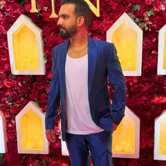 Slaying the blues, not suffering from them. A sharp blue suit for a Thursday night event.