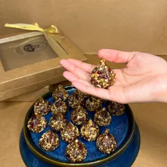 This is my Peanut & Cranberry Modak, a healthy and festive treat. Shaped traditionally, this energy ball is vegan, gluten-free, and made with pure, raw ingredients without any added sugar.